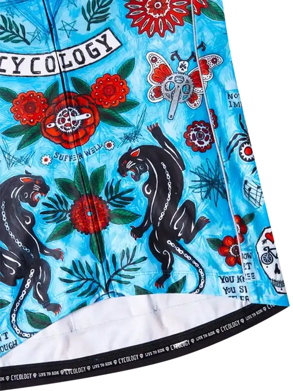 Vibrant blue cycling jersey with bold black panthers, red flowers, and 'CYCOLOGY' print for men's and women's bike wear