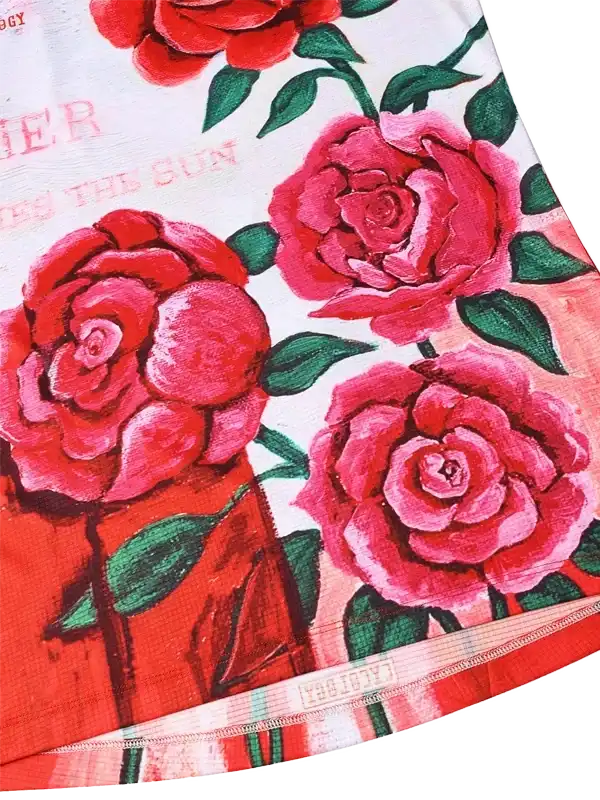 Women's cycling jersey with vibrant red rose floral print and green leaves on white background