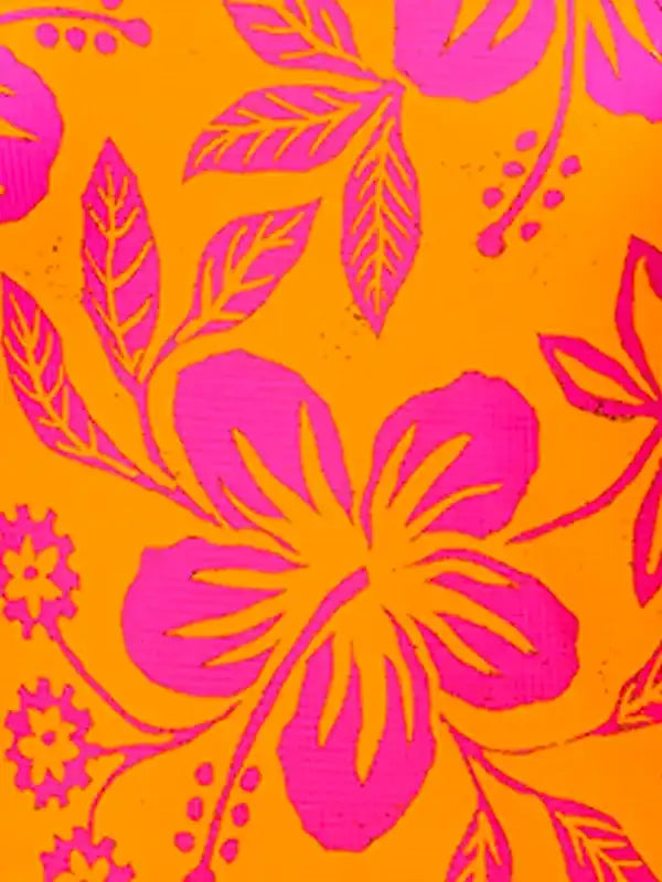 Vibrant pink hibiscus floral print on orange cycling apparel fabric