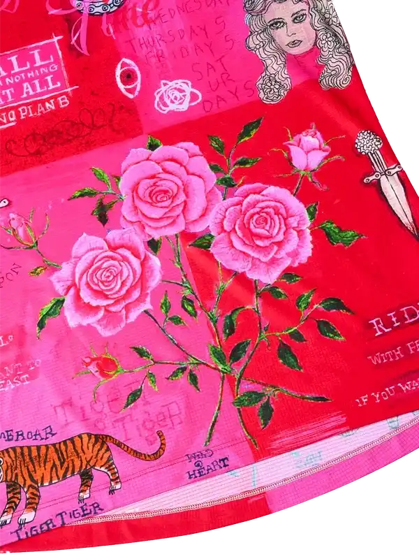 Vibrant pink cycling jersey with roses, tiger, and edgy graphics for women's cycling wear