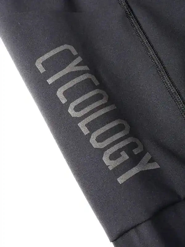 Black cycling apparel with 'CYCOLOGY' logo, high-quality fabric detail for men's and women's bike wear