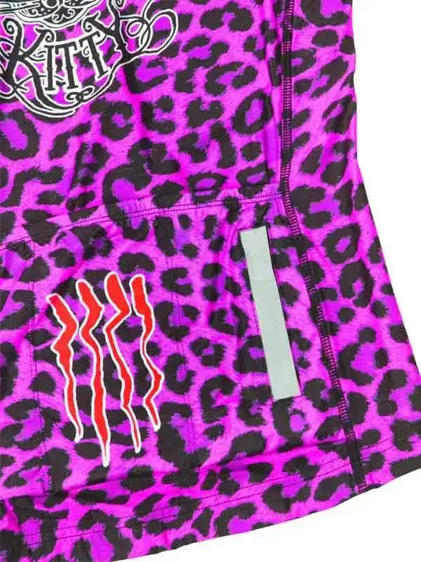 Vibrant purple leopard print cycling jersey with bold red claw graphic and reflective strip