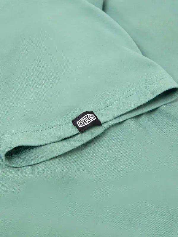 Mint green cycling t-shirt with black CYCOLOGY tag, soft fabric detail