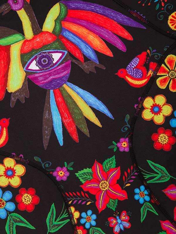 Vibrant floral and bird print cycling jersey with bold colors and artistic eye design