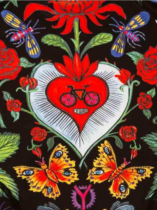Vibrant cycling apparel print with heart, bike, roses, and butterflies on black background