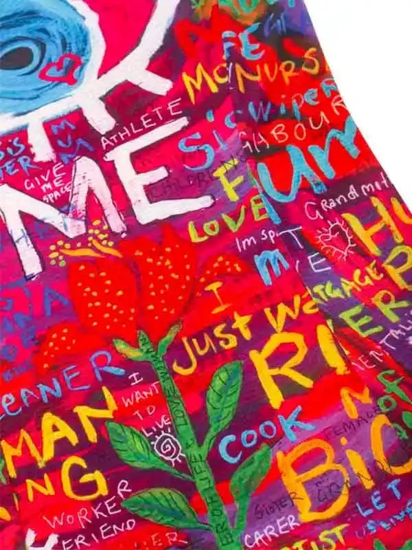 Colorful cycling jersey with bold graffiti-style text and floral design, perfect for women's cycling apparel