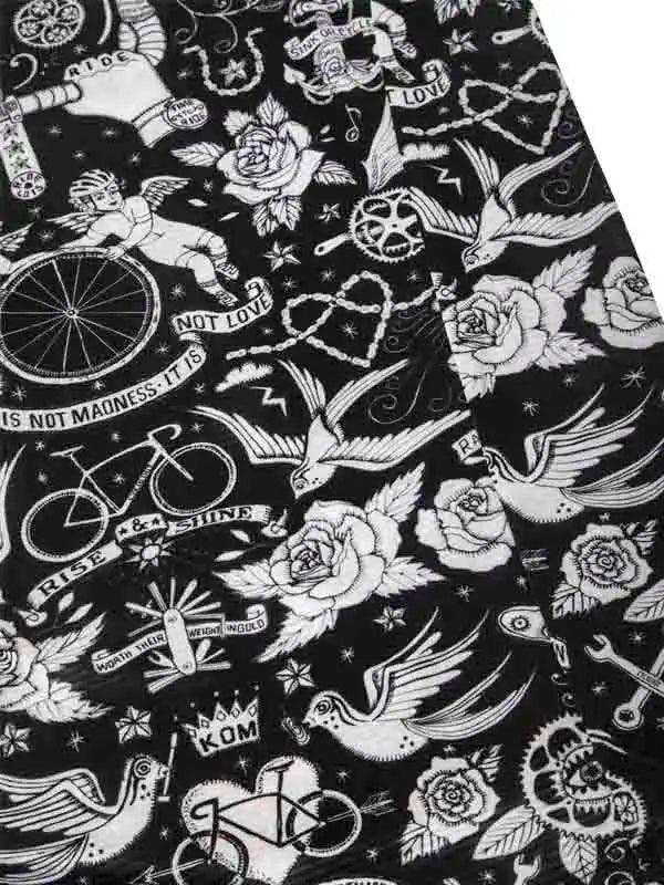Black and white cycling-themed fabric with roses, birds, bikes, and tattoo-style designs for men's and women's apparel