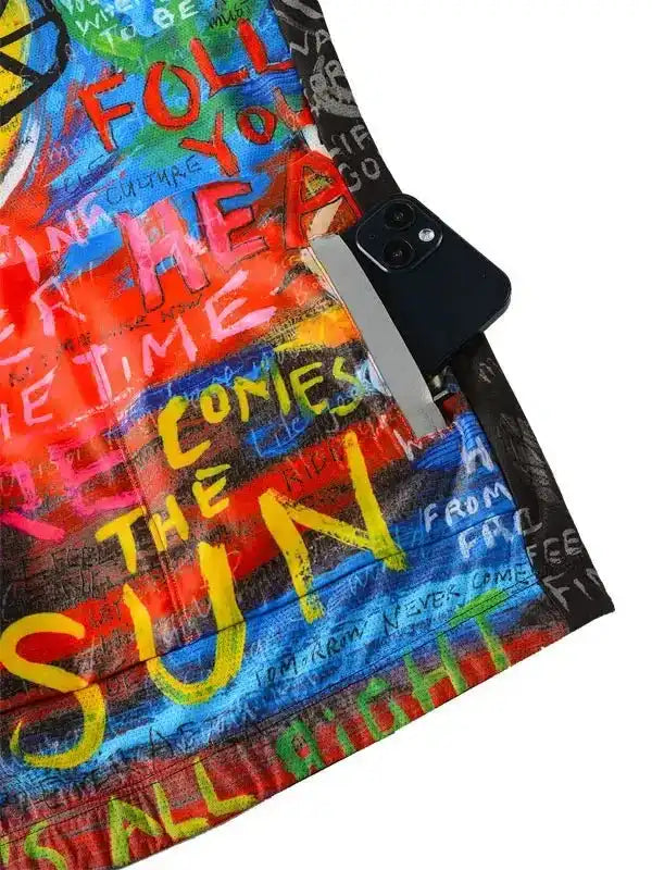 Colorful graffiti-style cycling jersey with bold text design and phone pocket detail
