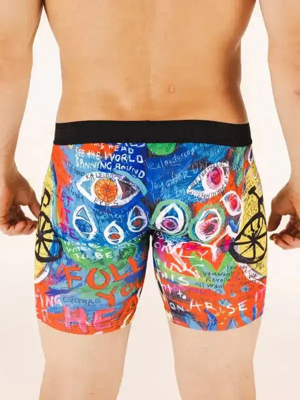 Men's colorful cycling shorts with graffiti art, eyes, and bike wheels design for active rides