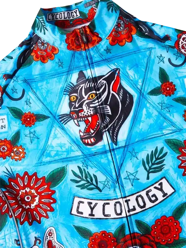 Men's cycling jersey with bold panther and floral print on blue, featuring 'CYCOLOGY' branding