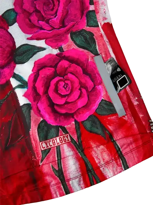 Vibrant pink rose print cycling jersey with 'CYCOLOGY' logo, ideal for women's or men's bike wear.