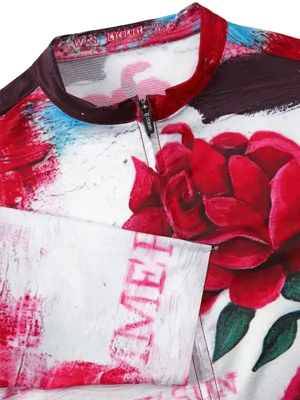 Women's cycling jersey with red rose print, breathable fabric, and full zipper for performance rides