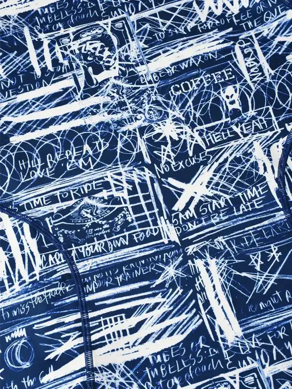 Blue cycling jersey with white graffiti-style print, motivational phrases, and zipper detail