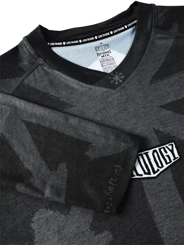 Men's black camouflage cycling jersey with 'Cycology' logo, performance fabric, and 'Live to Ride' tagline