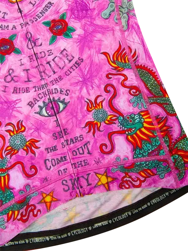Pink cycling jersey with dragon, roses, and 'I ride' text, featuring bold graphics and vibrant colors for women's or men's bike wear.