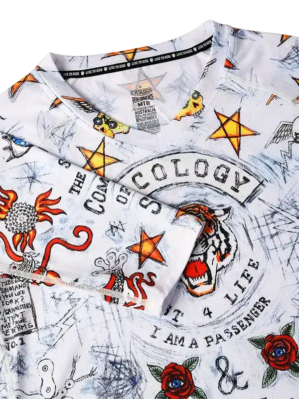 Men's cycling jersey with bold tiger, stars, and roses graphic design on white fabric