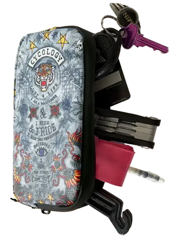 Cycology branded key organizer with tiger graphic, holding keys, cards, and tools for cyclists