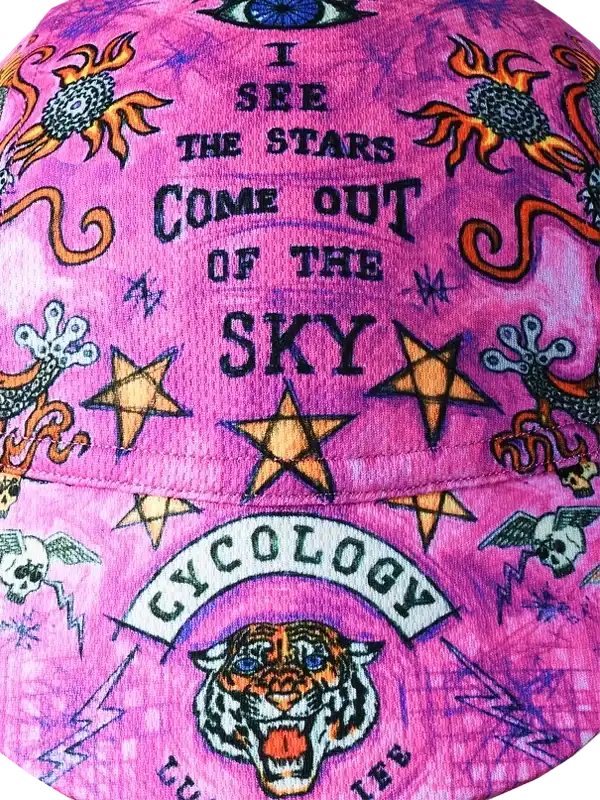 Pink cycling cap with tiger, stars, and 'I see the stars come out of the sky' design