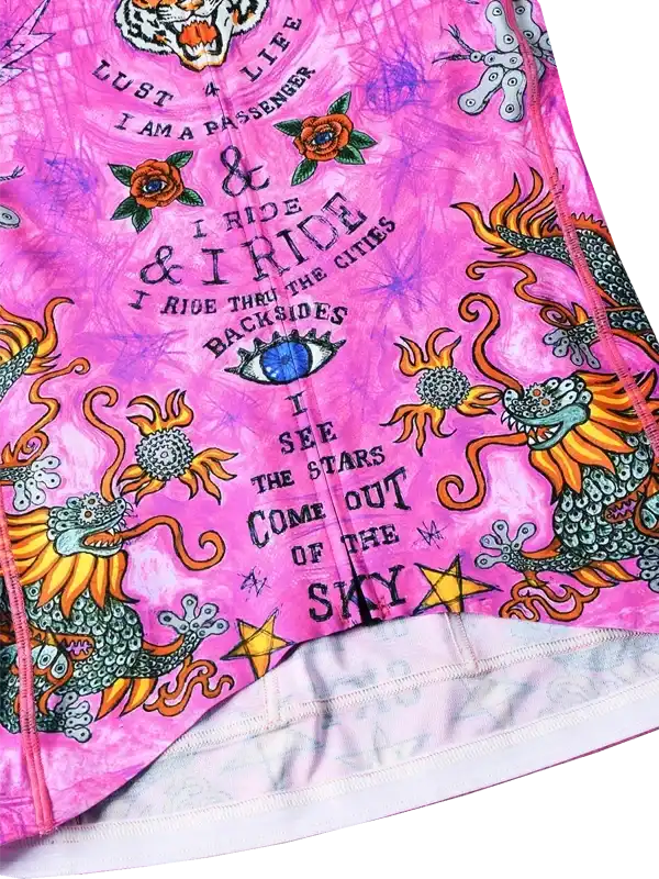 Pink cycling jersey with dragon and floral designs, bold text, and vibrant graphics for riders.