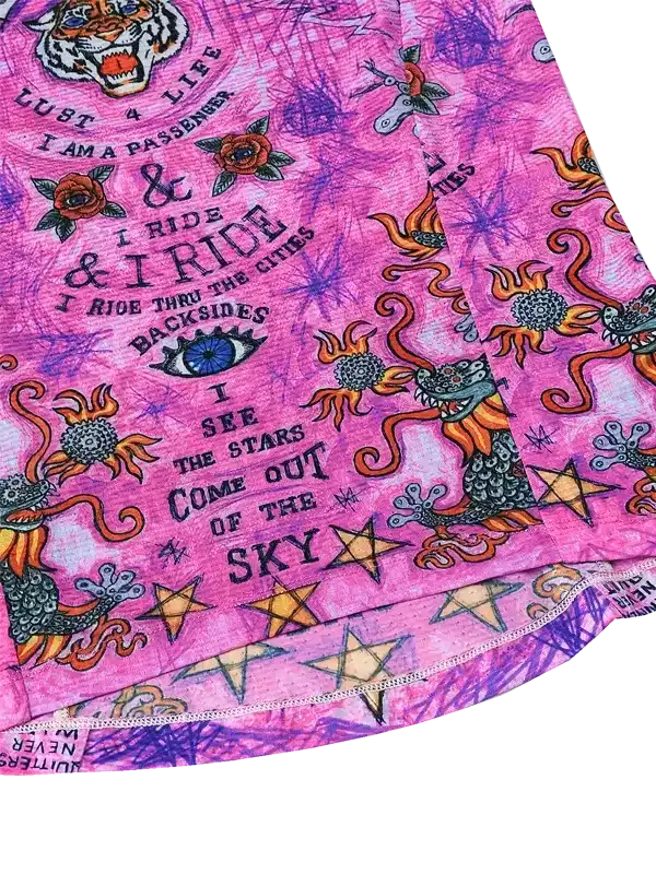 Vibrant pink cycling jersey with dragon, tiger, and star graphics, bold text & psychedelic design