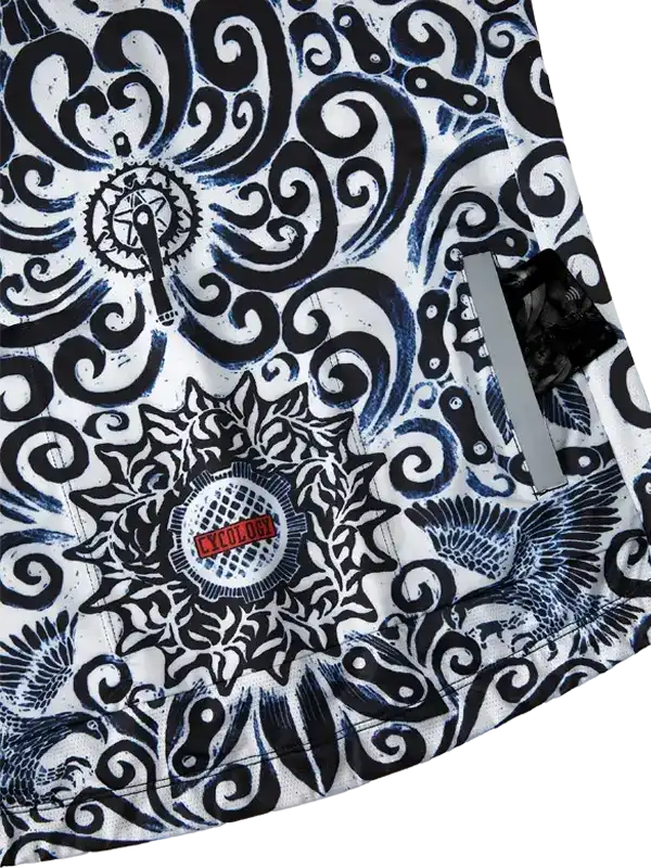 Men's cycling jersey with bold black-and-white swirls, gear, and bird motifs, featuring reflective strip and brand patch