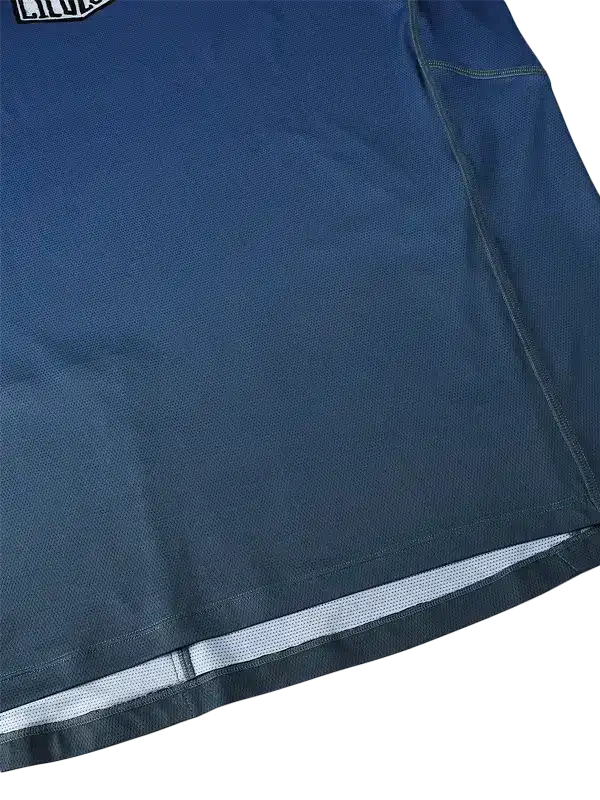 Navy blue cycling jersey with mesh panel and reflective trim for performance and visibility