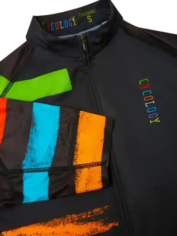 Black cycling jersey with colorful rainbow stripes and Cycology logo, performance fabric design