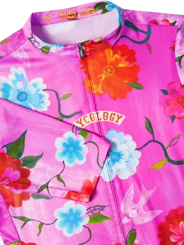 Pink floral women's cycling jersey with blue and orange flowers, bird print, and zip front
