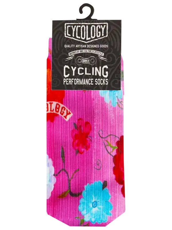 Pink floral cycling performance socks with bold red and blue blooms, ideal for bike rides and active lifestyle.