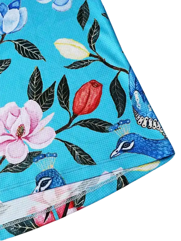 Blue cycling jersey with floral and peacock print, breathable fabric design