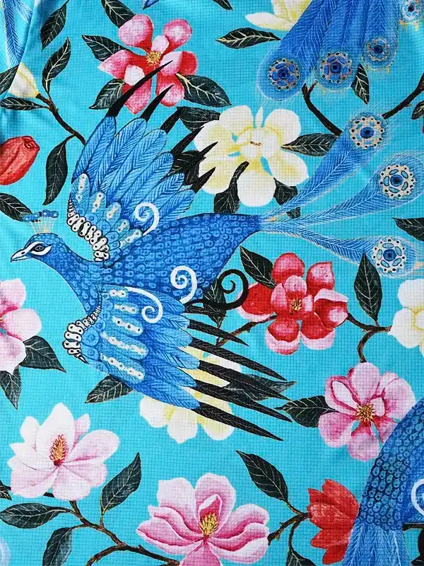 Vibrant blue peacock and floral print cycling jersey fabric, ideal for men's and women's bike wear