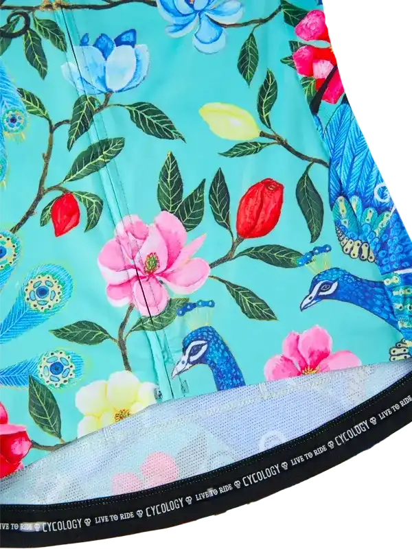 Floral and peacock print cycling jersey with mesh hem, vibrant turquoise background, women's bike wear
