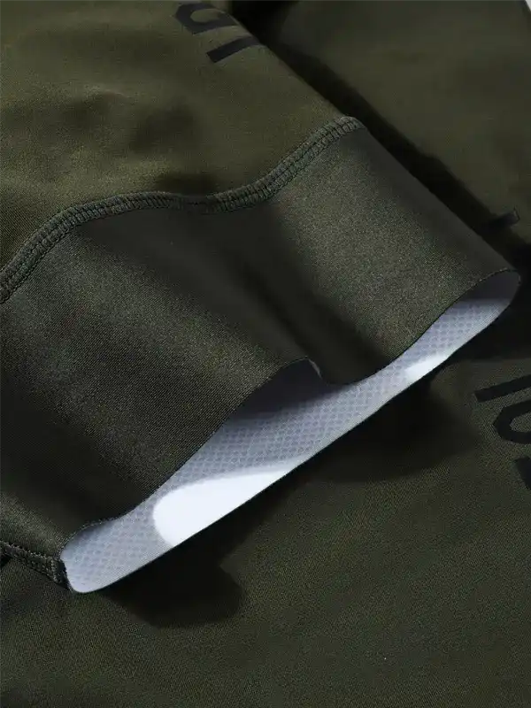 Olive green cycling shorts with padded chamois, breathable fabric, and ergonomic seams for comfort