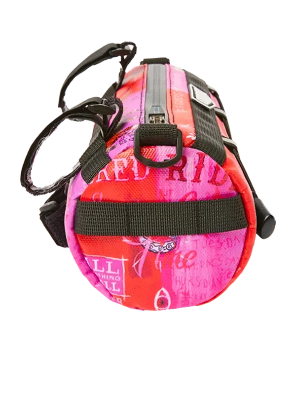 Pink and red cycling frame bag with bold graphic print, black straps, and zipper closure for bike storage