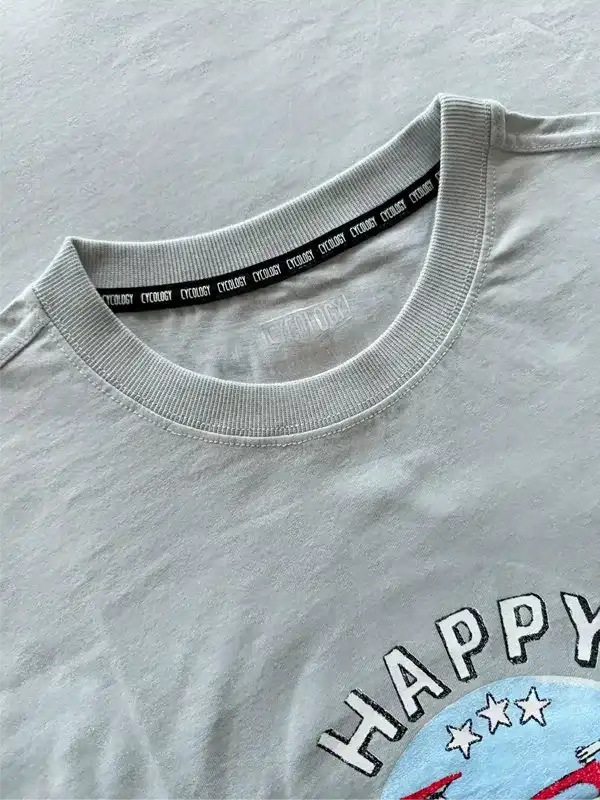 Gray cycling t-shirt with 'HAPPY' graphic and branded neck tape, soft fabric detail