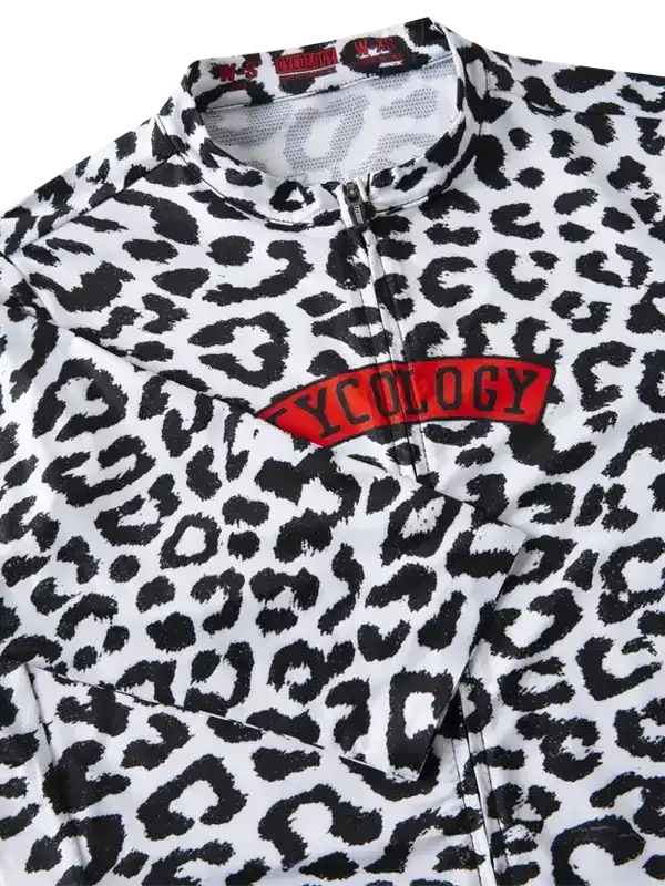 Women's leopard print cycling jersey with red Cycology logo, featuring zip neck and performance fabric