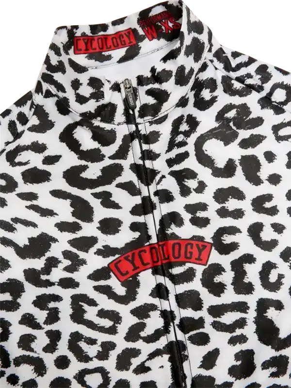 Women's leopard print cycling jersey with red Cycology logo, full zip front, high collar