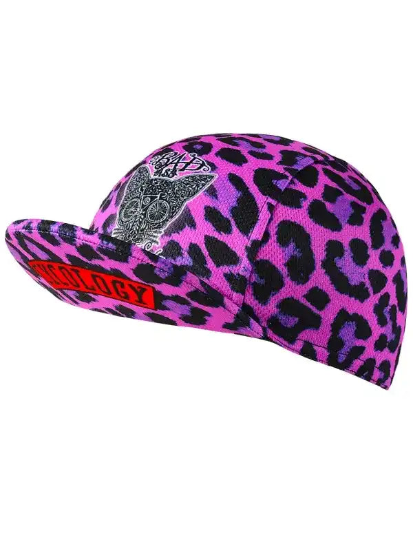 Pink leopard print cycling cap with skull design and red logo, stylish women's bike accessory