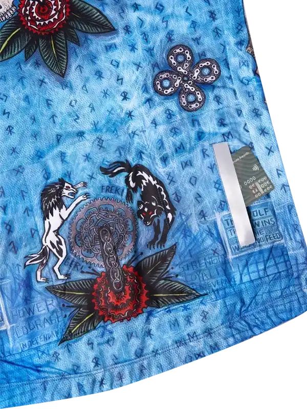 Blue cycling jersey with wolf, flower, and chainlink designs, featuring bold graphics and performance fabric