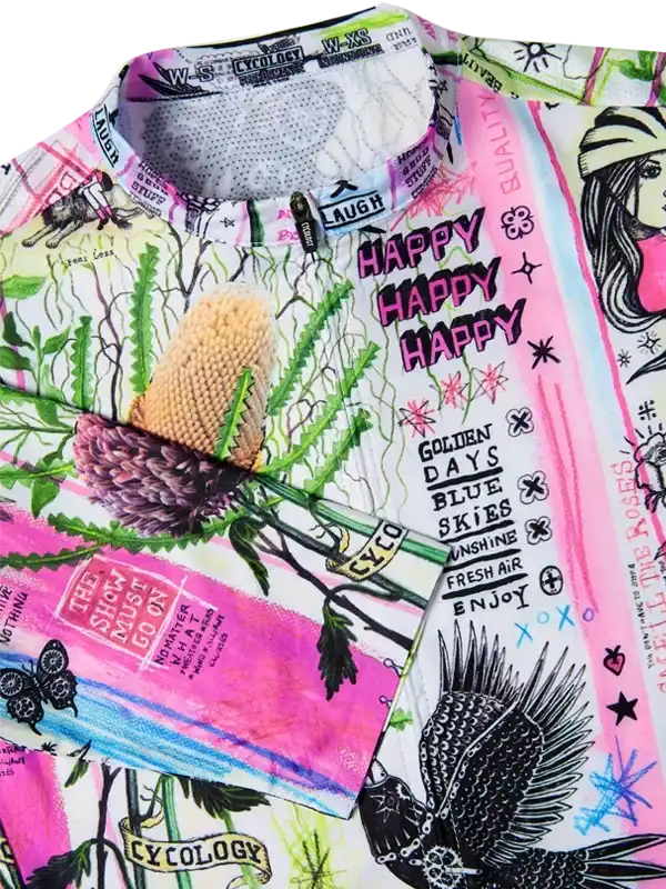 Vibrant cycling jersey with floral, bird, and text print in pink, green, and black