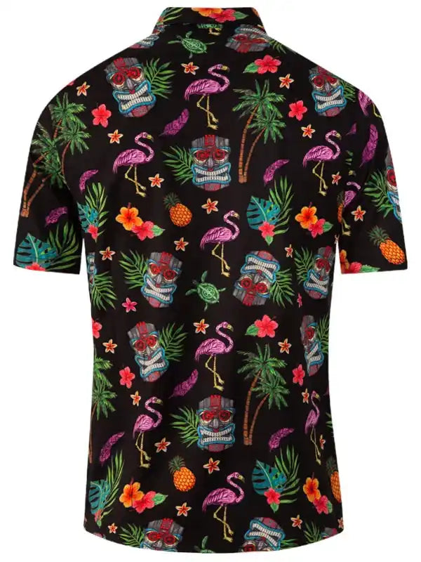 Tropical print men's short sleeve shirt with flamingos, pineapples, and tiki masks on black fabric