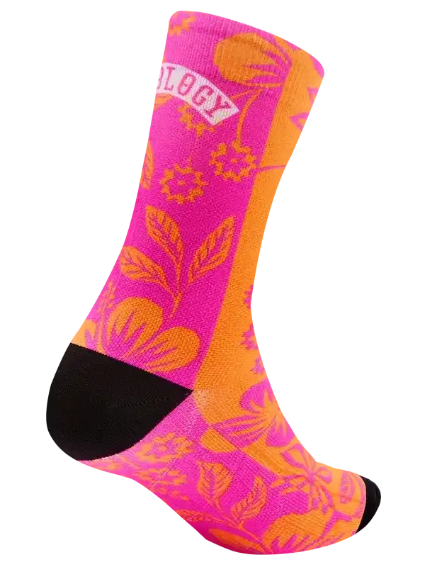 Vibrant pink and orange floral cycling socks with black toe and heel, featuring bold botanical design for riders.
