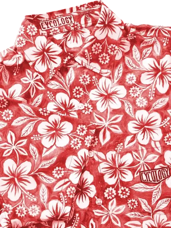Red floral cycling shirt with white hibiscus print and Cycology branding