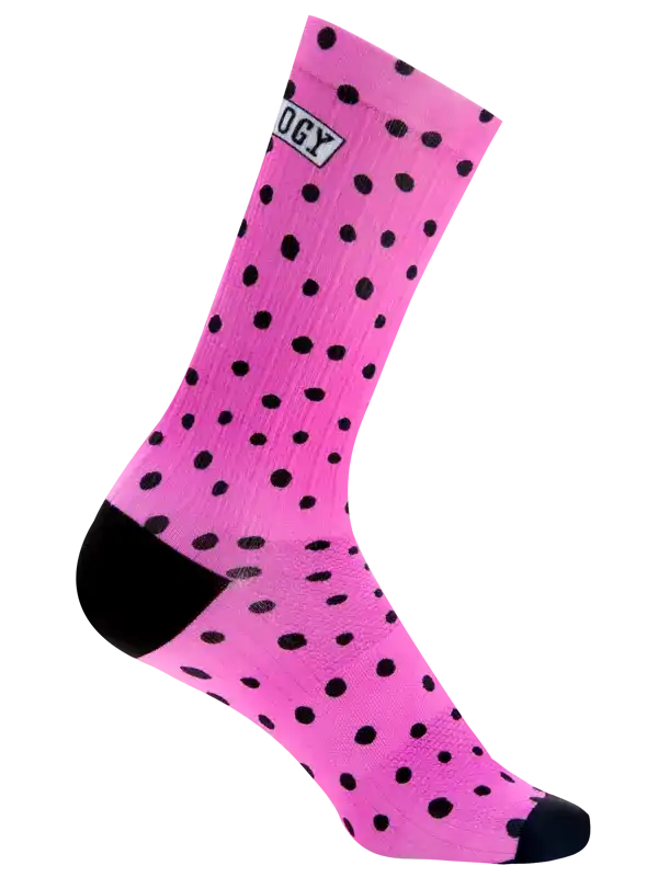 Pink cycling sock with black polka dots and black toe/heel, featuring 'OGY' logo on cuff