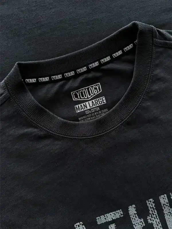 Black men's cycling t-shirt with Cycology brand tag, 100% cotton, size large, featuring repeating logo on collar.