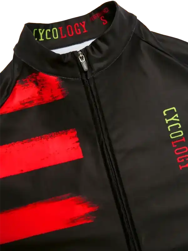 Black cycling jersey with bold red stripes and neon green CYCOLOGY branding, featuring full zip and performance fabric.
