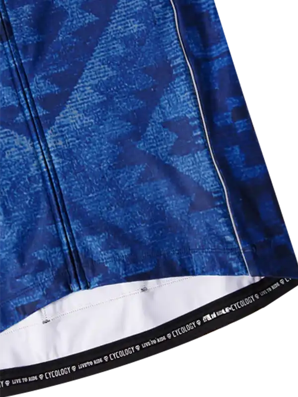 Blue patterned cycling jersey with white hem and 'CYCOLOGY' waistband detail