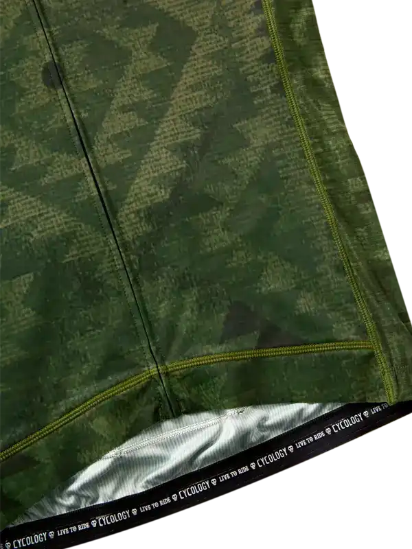 Green camouflage cycling jersey with yellow stitching and 'CYCOLOGY LIVE TO RIDE' waistband detail