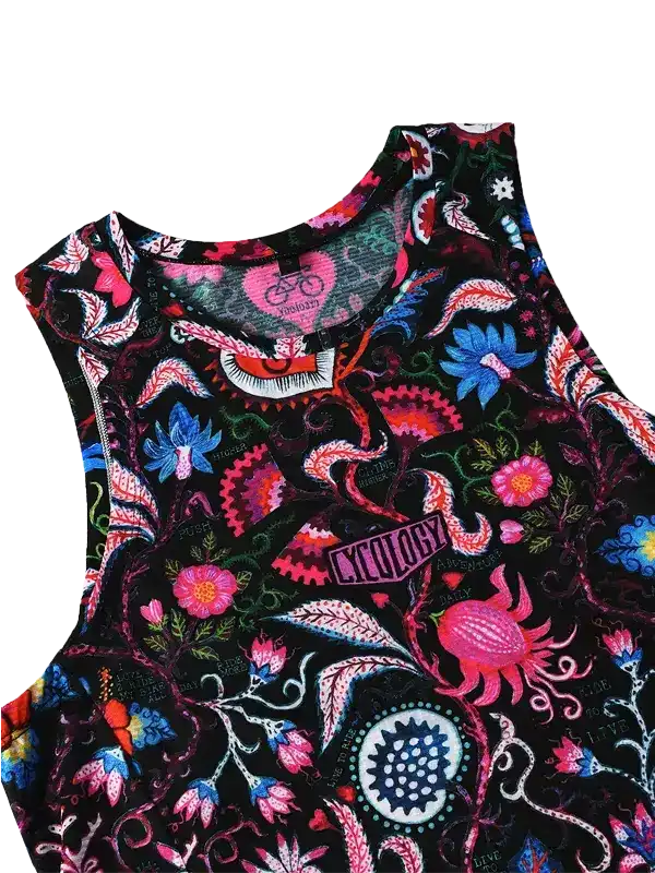 Women's cycling tank top with vibrant floral and abstract print on black fabric, featuring brand tag