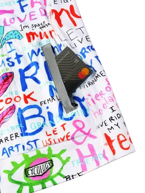 Colorful cycling shorts with vibrant graffiti-style text and designs, featuring a secure zippered pocket.